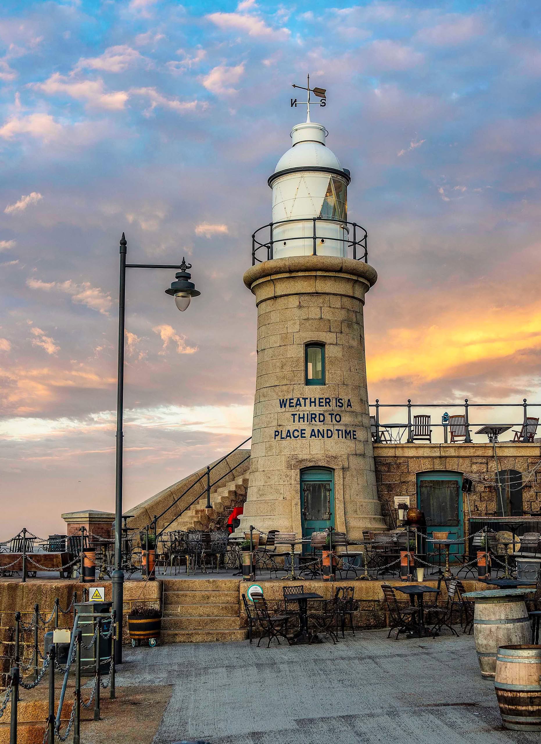 The lighthouse at the end of the Harbour Arm in Folkestone shortly before sunset.
